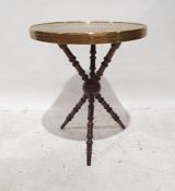 Eastern brass-topped circular table with decorative moulding to the brass top, on turned triform