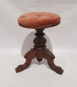 Circular piano stool on turned and carved supports to three carved ogee supports