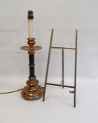 Brass table lamp of column design, on circular base, 53cm high and a brass folding table easel, 46cm