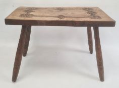 Elm topped stool, the rectangular top with carved decoration, on four turned supports, 62cm x 44cm