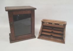 Early 20th century oak desk stationery organiser, the hinged cover with three ink wells for