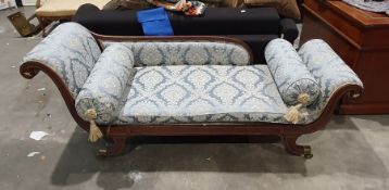 Regency sofa in blue ground foliate upholstery, outswept legs with brass caps and castors  Condition