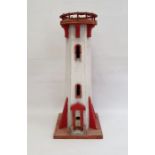 Wooden model of a lighthouse painted in red and white, 68cm high