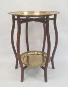 Two-tier Eastern hardwood occasional table, the folding bamboo-effect stand fitted with two brass