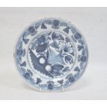 Probably English delft blue and white plate decorated with flowers and fruit 23cm diameter.