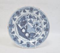 Probably English delft blue and white plate decorated with flowers and fruit 23cm diameter.