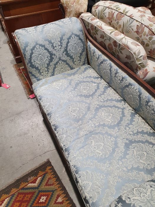 Regency sofa in blue ground foliate upholstery, outswept legs with brass caps and castors  Condition - Image 15 of 16