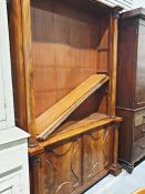 Mahogany bookcase cabinet with moulded pilasters, adjustable shelving, two cupboard doors, on plinth