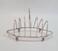 Silver six-division toast rack by Nayler Brothers, London 1989 of shaped oval form with ring handle,