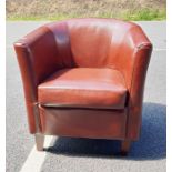 20th century brown leather tub chair on tapering supports Condition ReportSome wear to seams. Chip