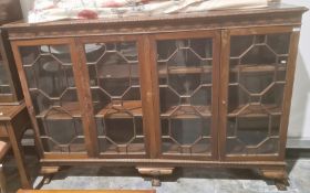 Late 19th/early 20th century bookcase with egg and dart moulded cornice above four astragal-glazed