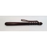 Turned wooden truncheon with leather strap