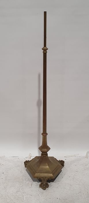 Brass standard lamp with shaped hexagonal base and paw feet