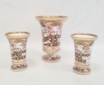Garniture of three Spode vases each of cylindrical form with flared rims and bead borders, decorated