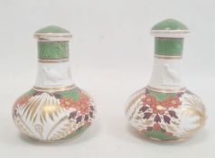 Pair of Spode bottles and covers circa. 1820, the necks with moulded decoration of a bird and the