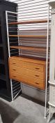Ladderax shelving unit, the white uprights with three shelves and chest of three drawers, 93cm