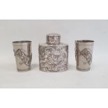 Chinese white metal tea canister of oval form, decorated with dragons in relief, unmarked, 11cm high