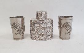 Chinese white metal tea canister of oval form, decorated with dragons in relief, unmarked, 11cm high
