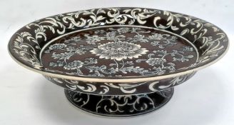 Large modern comport by India Jane, circular form decorated with flowerheads on a brown ground and