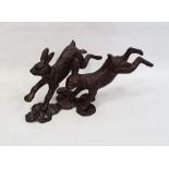 Modern bronze-effect metal sculpture / statue group of two leaping hares / rabbits, approx 52cm long