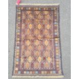 Baluchi rug, the central field decorated with brown lozenges within blue borders and within a floral