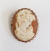 Carved shell cameo brooch, oval, female portrait profile and set in gold-coloured mount with wavy