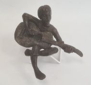 Jill Sanders (b.1930) bronze figure of a seated boy playing the guitar, signed and numbered 3/25,