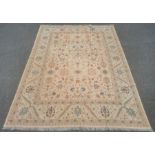 Large kilim, the central panel decorated with flowers with stylised flowers and plants within a wide