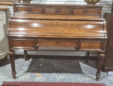 19th century rosewood writing table with three frieze drawers above the lockable front, on turned