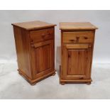 Pair of 20th century pine bedside tables with single drawers above cupboard doors, on squat bun