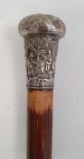 Walking cane with Chinese white metal finial, decorated with figures in a landscape, monogrammed
