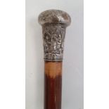 Walking cane with Chinese white metal finial, decorated with figures in a landscape, monogrammed