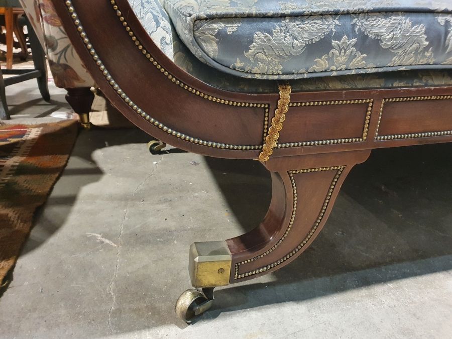 Regency sofa in blue ground foliate upholstery, outswept legs with brass caps and castors  Condition - Image 6 of 16