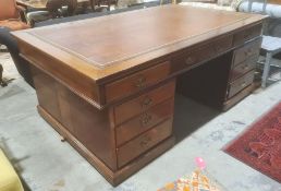 Early 20th century mahogany partners' desk with brown leather inset top, each pedestal with three