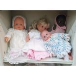 Four composition dolls and a quantity of dolls accessories