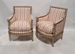 Pair of French-style armchairs with carved cream painted show frame, upholstered in cream and pink