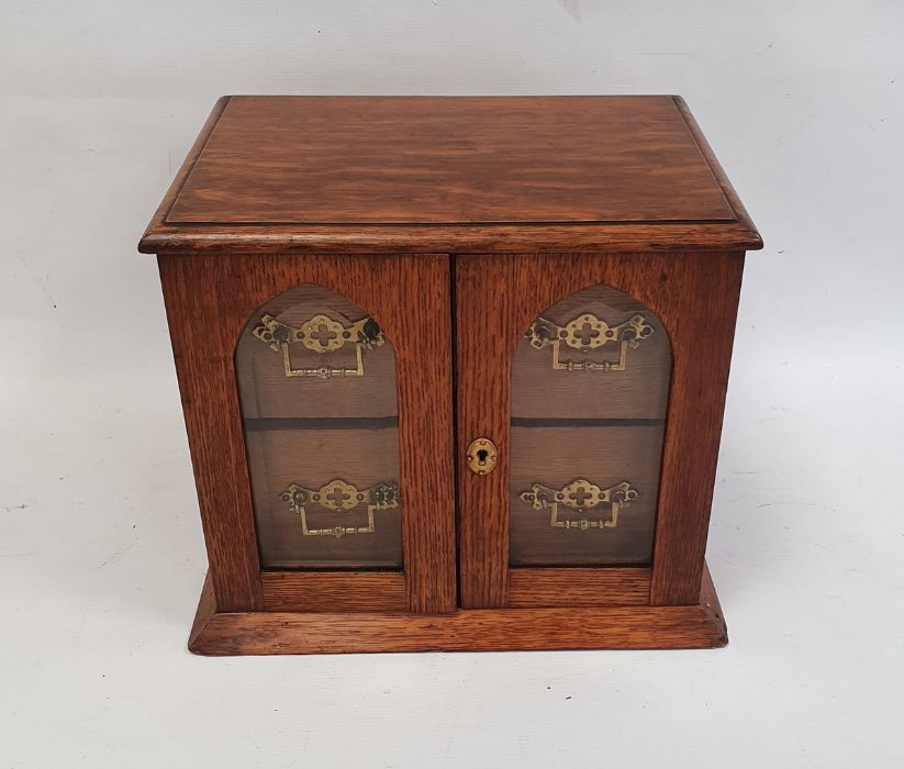 Edwardian oak smoker's cabinet, the two glazed doors with bevelled glass revealing two drawers, 26cm - Image 2 of 5