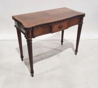 Early 20th century mahogany card table, the serpentine front fluted and supported to peg feet