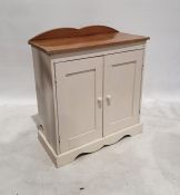 Pine and white painted cupboard, the rectangular top above two painted cupboard doors, on bracket