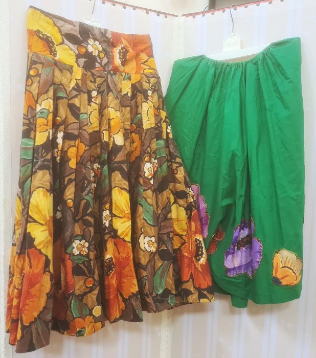 Two vintage 1950's cotton skirts, one green with large applique flowers around the hem , the other