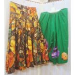 Two vintage 1950's cotton skirts, one green with large applique flowers around the hem , the other