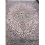 Turkish wool rug in cream, green and red, with floral decoration to centre, 197cm x 300cm