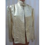 Chinese silk jacket, patterned in gold and silver thread, frog fastening