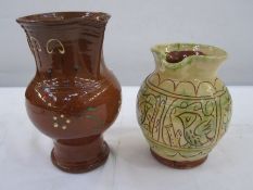 Studio pottery jug in yellow decorated with birds, 16.5cm high and another studio pottery jug,