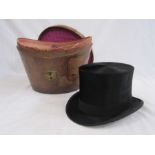 Black top hat labelled Lincoln Bennet & Co with a leather hatbox with various labels and