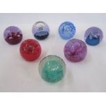 Seven assorted Caithness paperweights to include 'Moonflower', 'Cauldron', 'Ozone', etc (7)