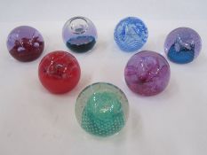 Seven assorted Caithness paperweights to include 'Moonflower', 'Cauldron', 'Ozone', etc (7)
