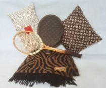 Bulgari silk cushion with the logo, a Louis Vuitton silk cushion with the logo, a Dunlop wooden