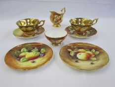 Pair of Coalport cabinet cups and saucers painted by M Pinter and R Dale, fruit with gilt interiors,