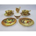 Pair of Coalport cabinet cups and saucers painted by M Pinter and R Dale, fruit with gilt interiors,